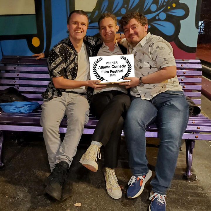 John A. Bryant, JoJo Scanlon, and Will Brady holding up their award from the Atlanta Comedy Film Festival